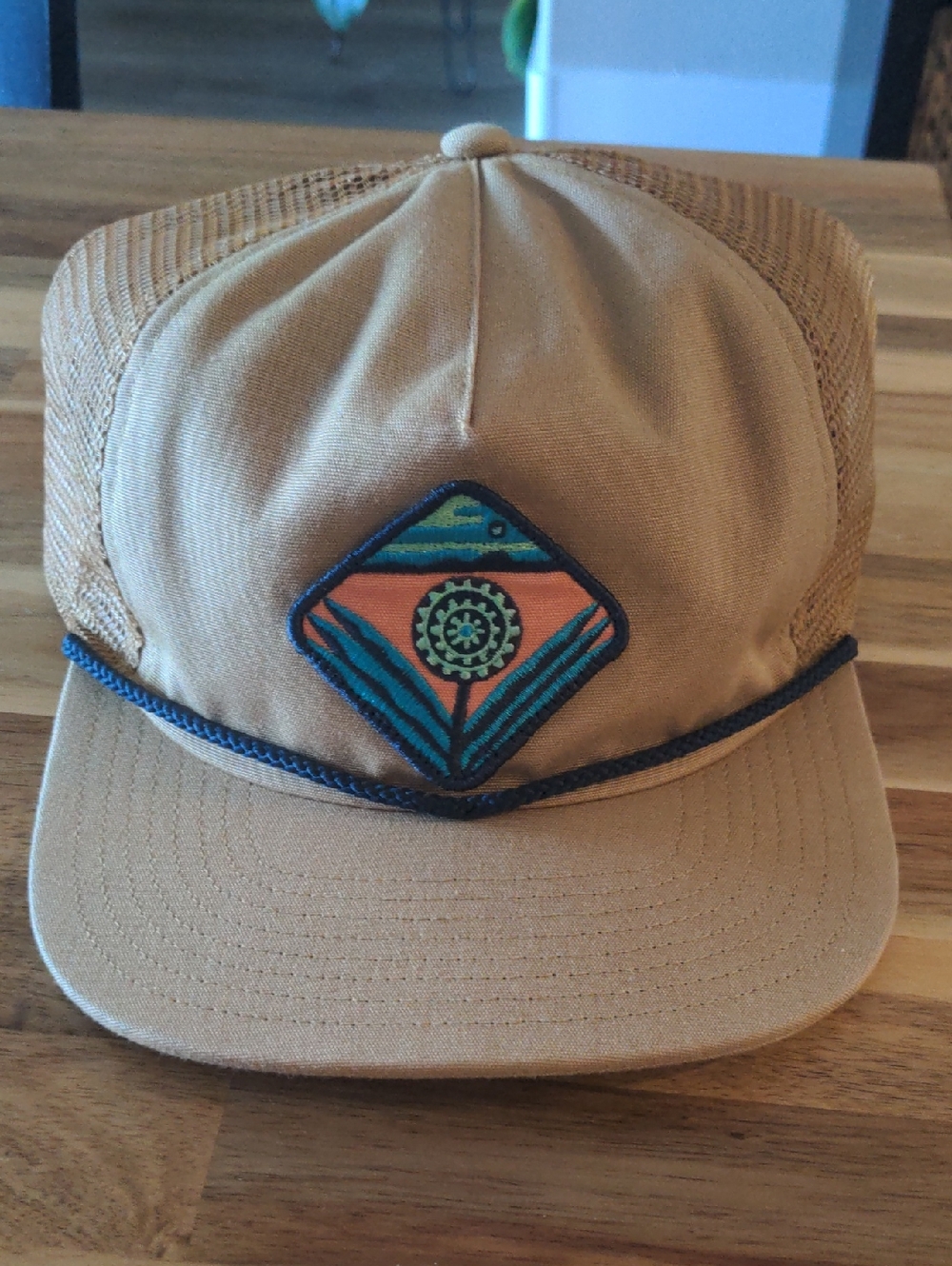 Patagonia Tan Duckbill Trucker Hat with Orange & Teal Patch